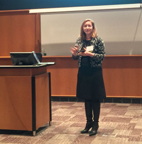 Alix Hart speaking during a marketing presentation at a Minneapolis event
