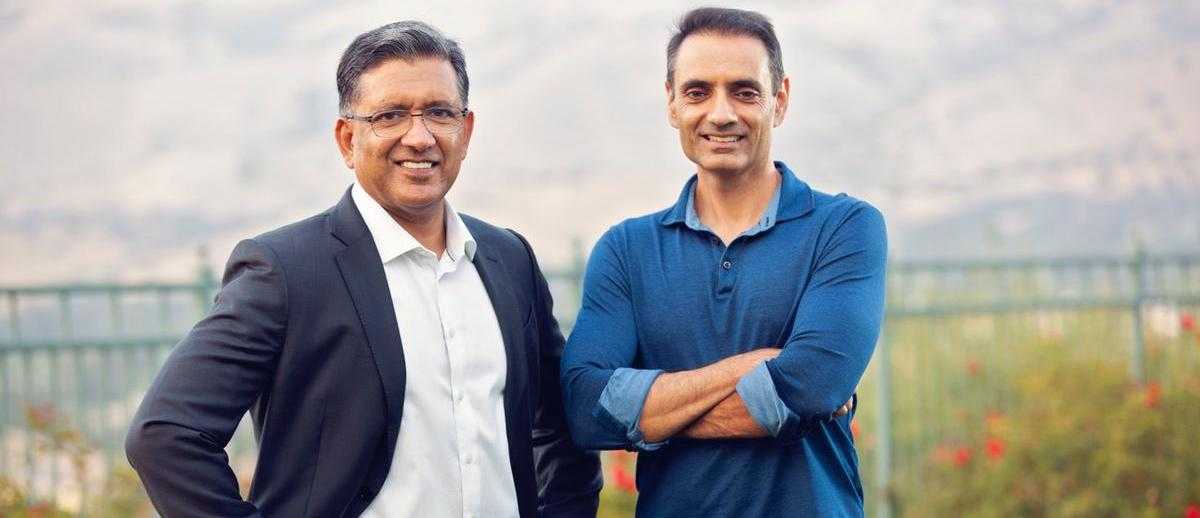 Alkira co-founders Amir Khan and Atif Khan standing outdoors