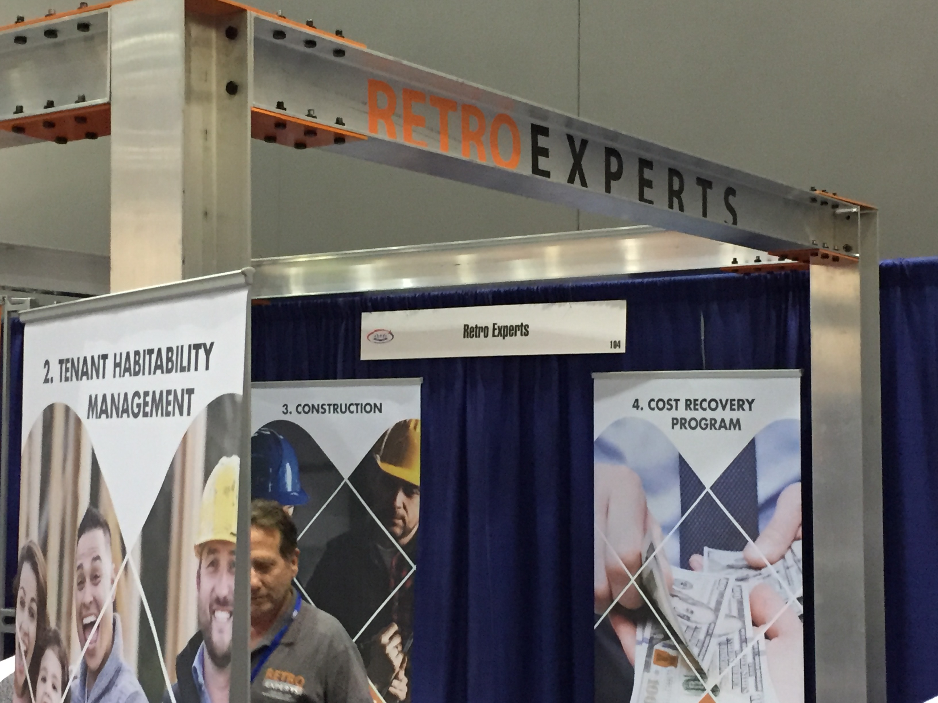 Retro Experts trade-show booth with coordinated printed display banners