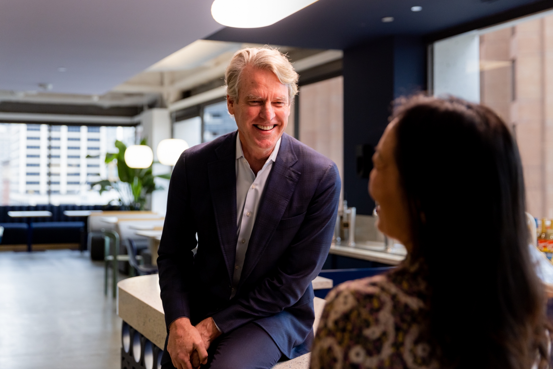 Allan Thygesen smiling during a conversation in a Docusign office