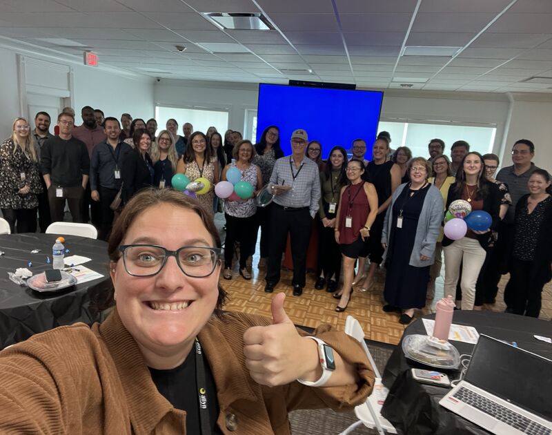 Allyn employees gather for a group selfie during the May 2023 celebration of Allen Trevett’s birthday and a team award.