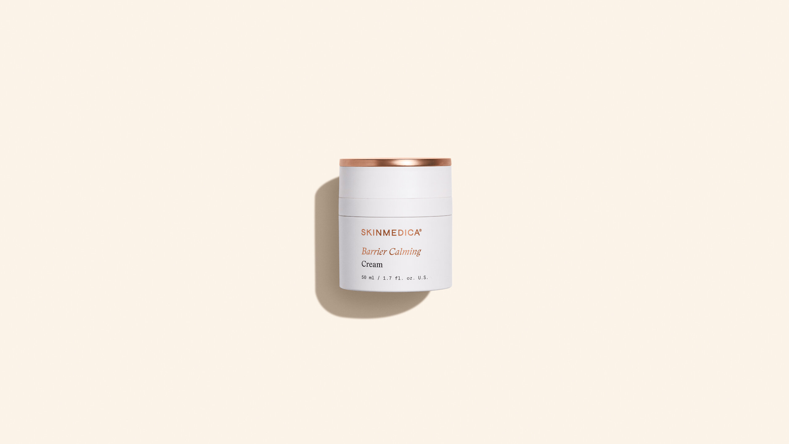 SkinMedica Barrier Calming Cream in a white jar with a copper-colored lid
