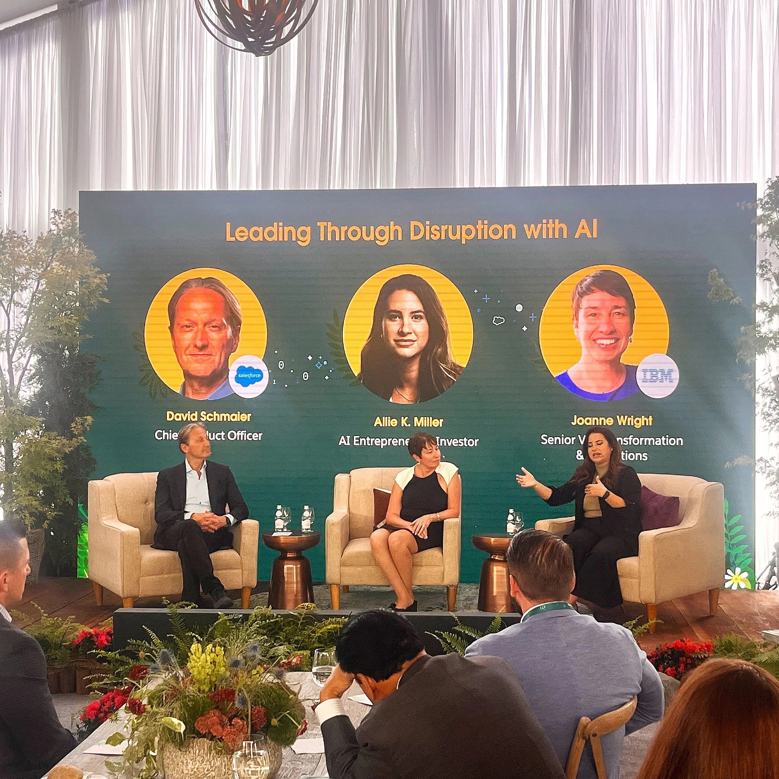 Allie K. Miller speaking on a panel about AI at an event