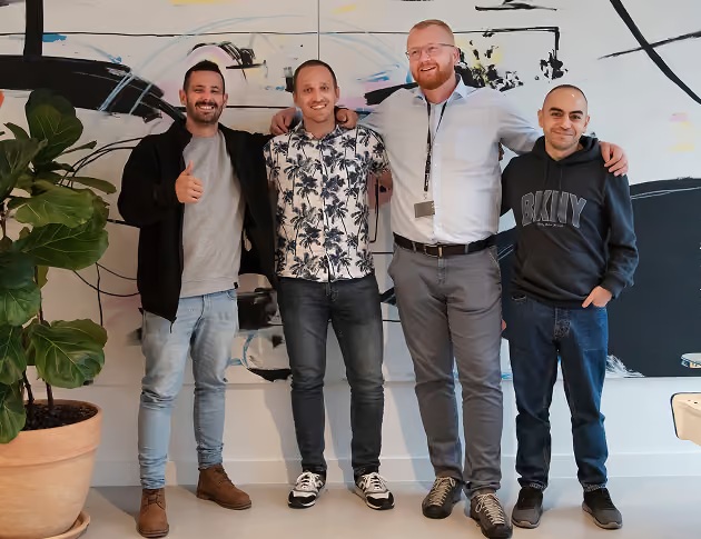Four men posing together in the photograph accompanying ALLSTARSIT’s Yotpo testimonial