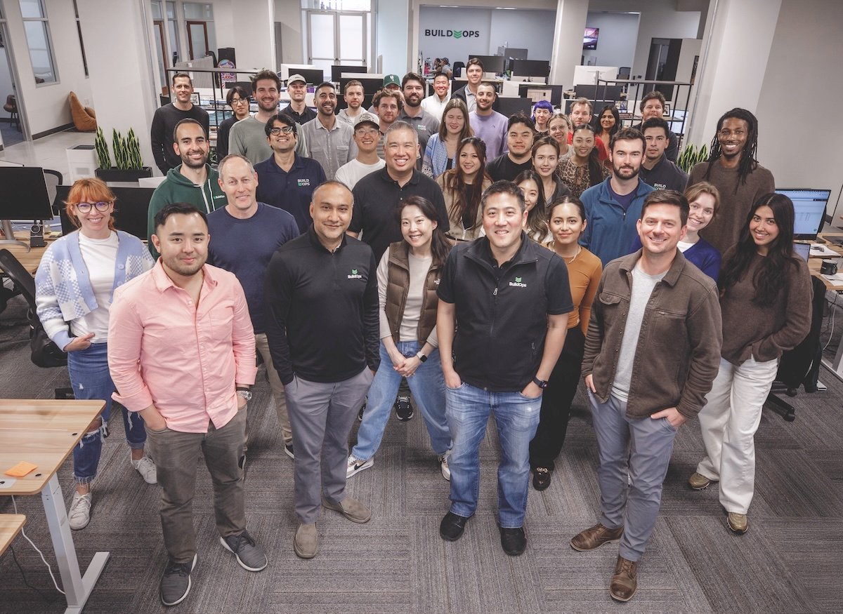 Alok Chanani, near the front in a black BuildOps shirt, with colleagues in their West Los Angeles office