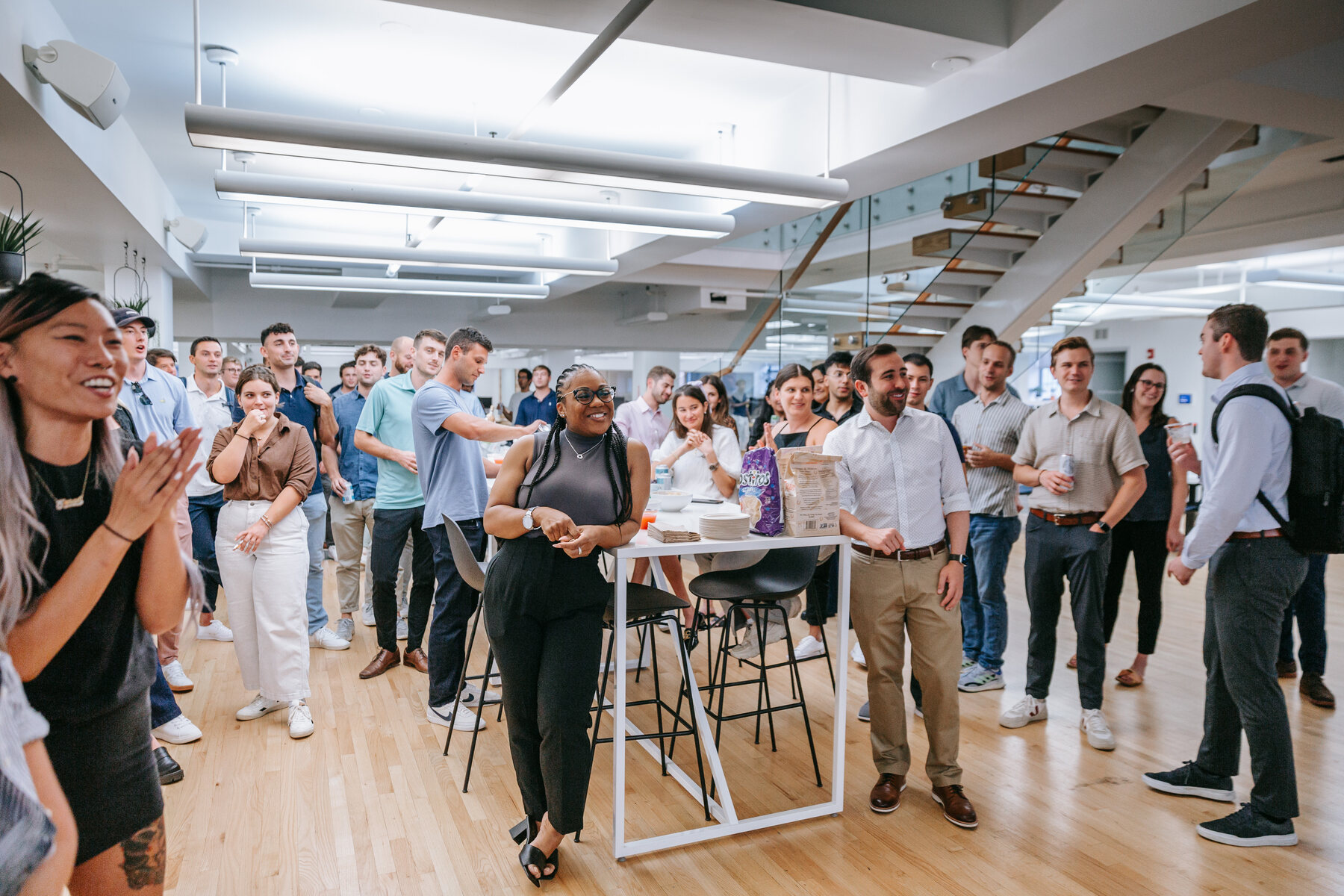 AlphaSense employees gathered in a bright New York office