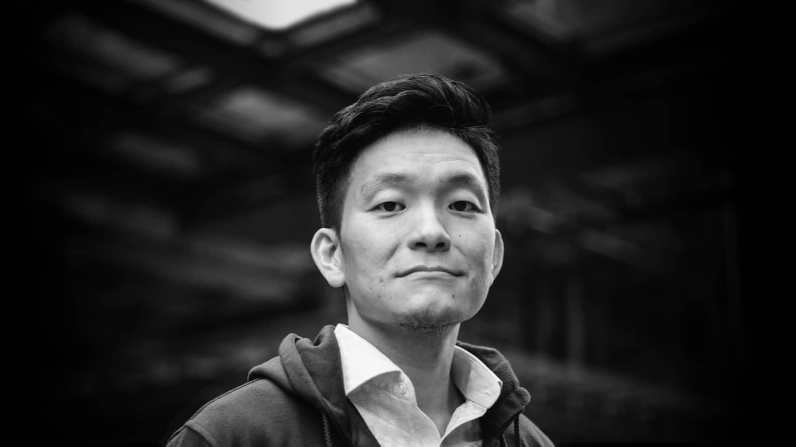 Black-and-white portrait of Tiger Fang, Kargo co-founder