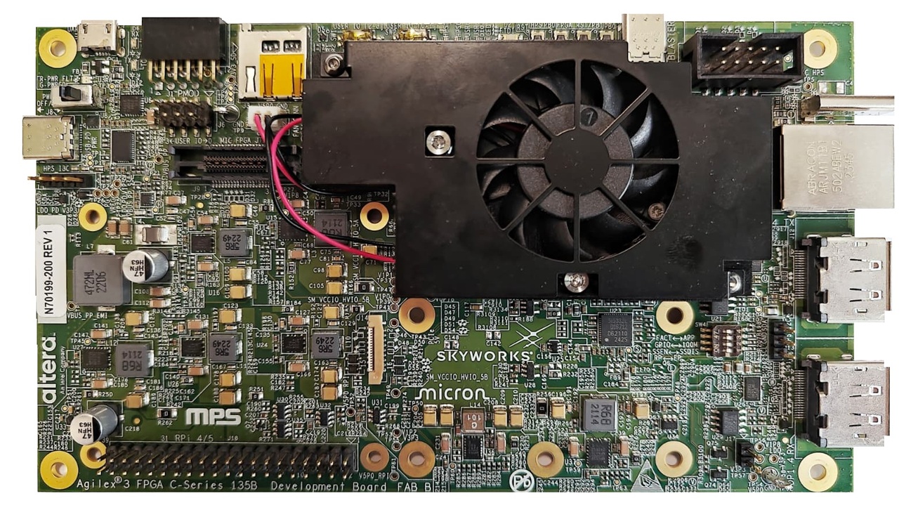 Agilex 3 C-Series development board with a central cooling fan, connectors and memory components