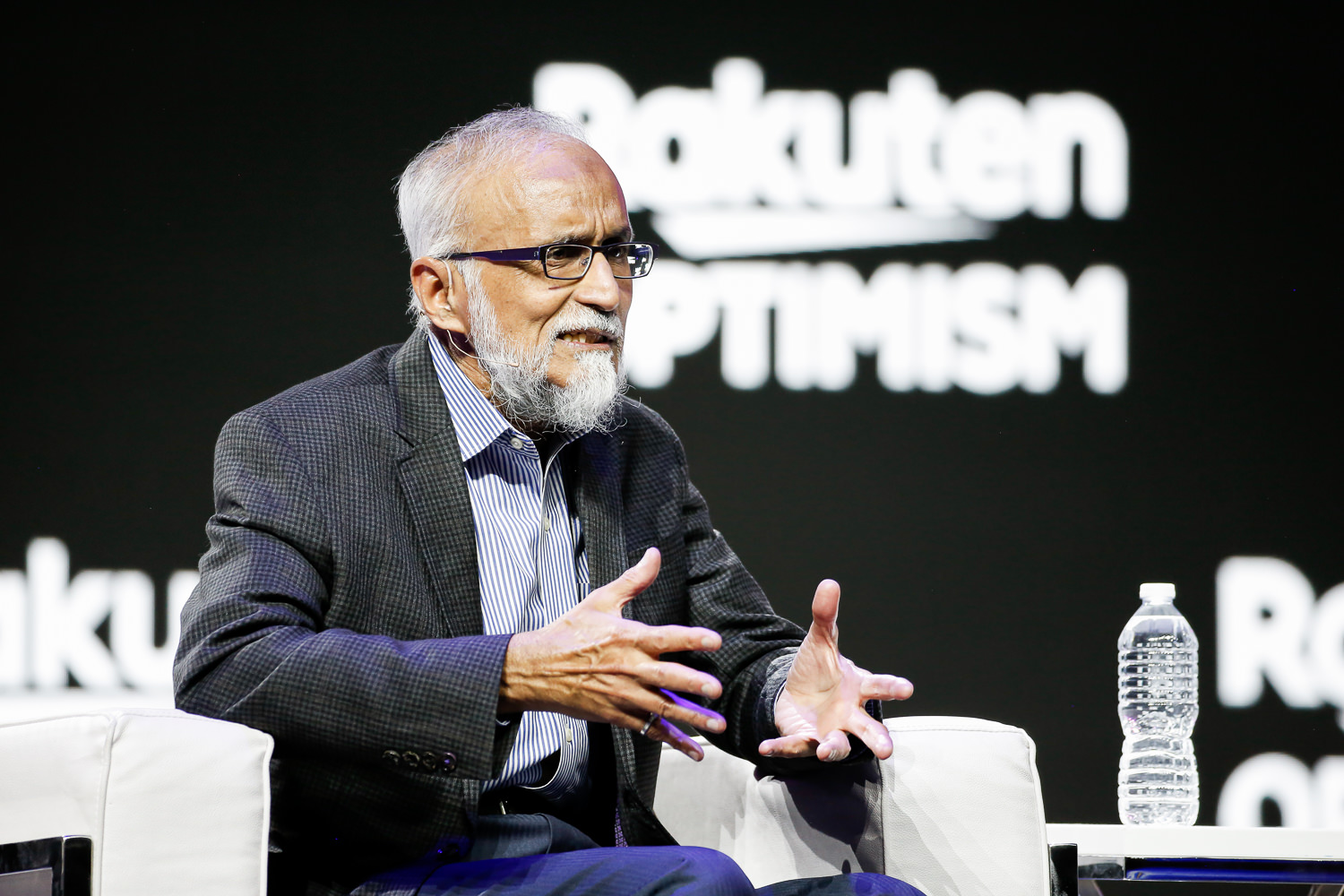 Altiostar co-founder Ashraf Dahod speaking on stage at Rakuten Optimism in San Francisco in 2019