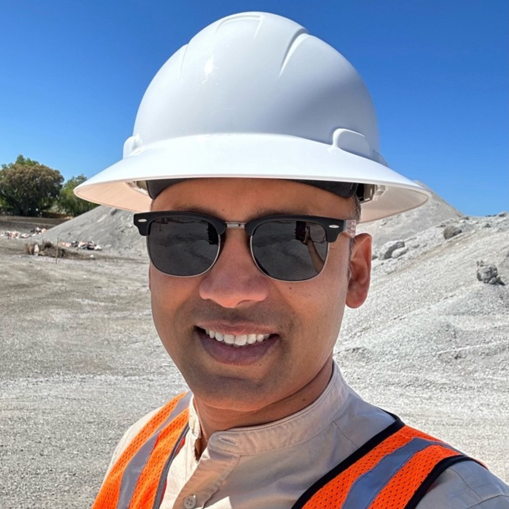 Amar Amte, founder and CEO of Pegbo, on a construction site in a hard hat and safety vest
