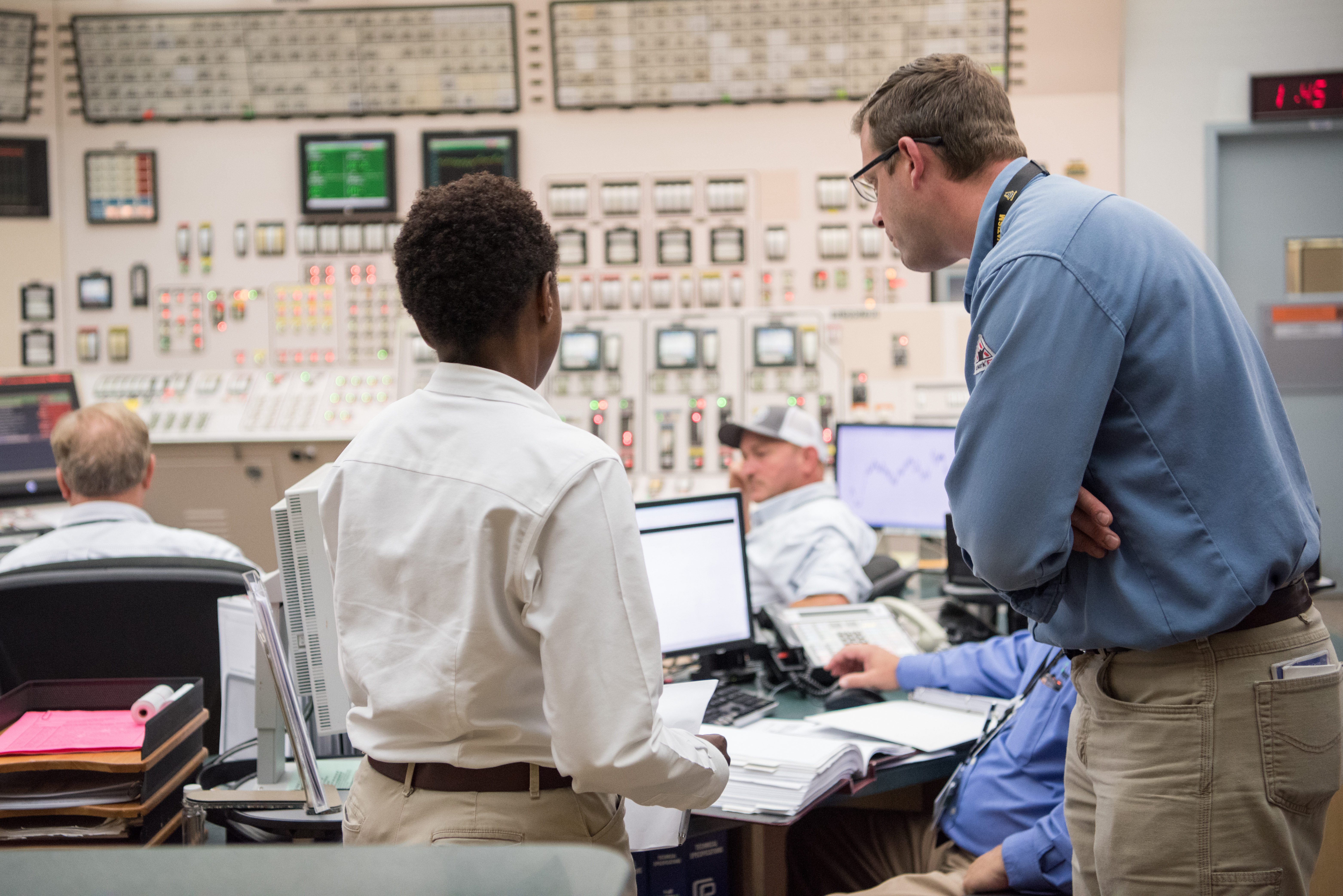 Operators at instrument panels inside Callaway Energy Center’s control room