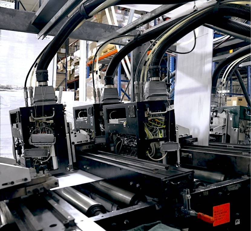 Close view of X-BAR inline printing equipment in the American Litho case study
