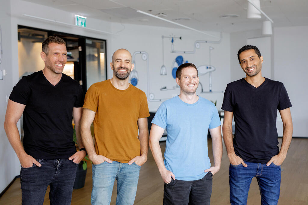 DualBird co-founders standing together in an office: Amir Gilad, Ehud Eliaz, Gilad Tal and Ohad Gamliel