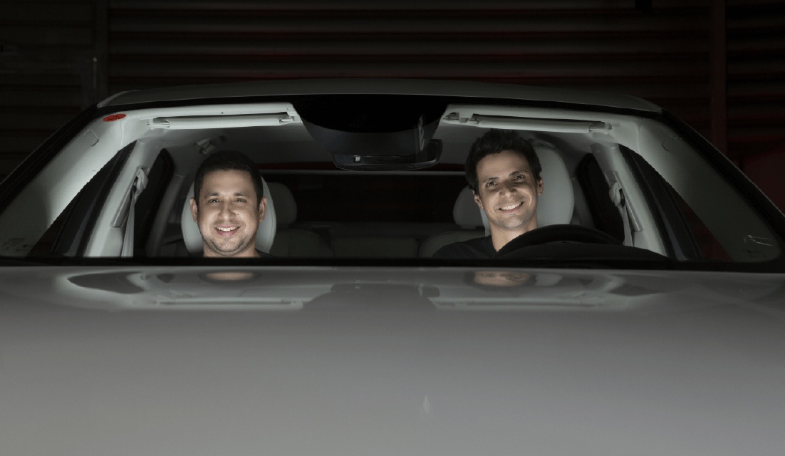 Amir and Ohad Hever seated together inside a car