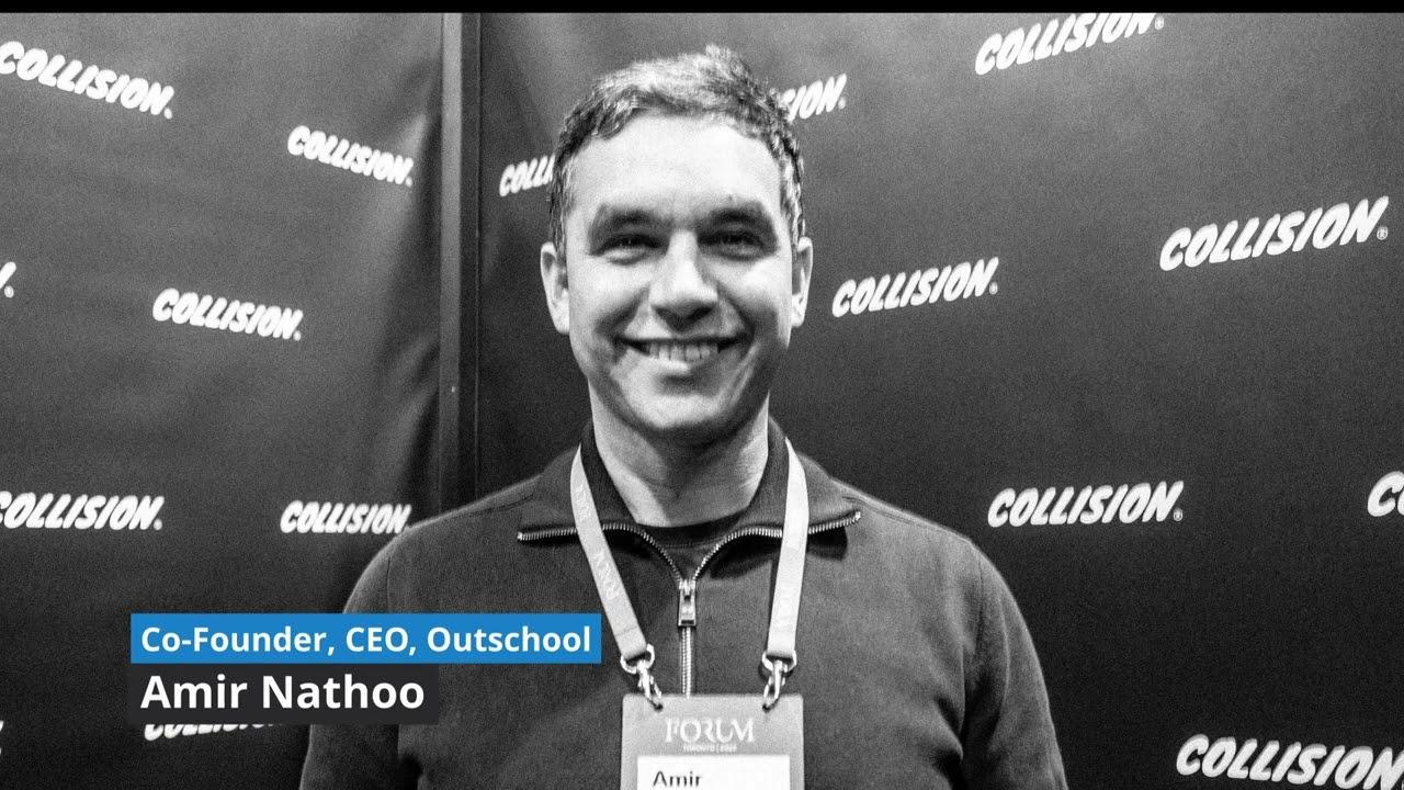 Amir Nathoo smiling at the Collision conference in a BNS interview