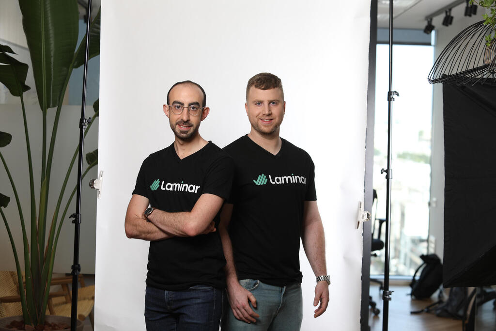 Laminar co-founders Oran Avraham, left, and Amit Shaked, right, in matching black Laminar shirts
