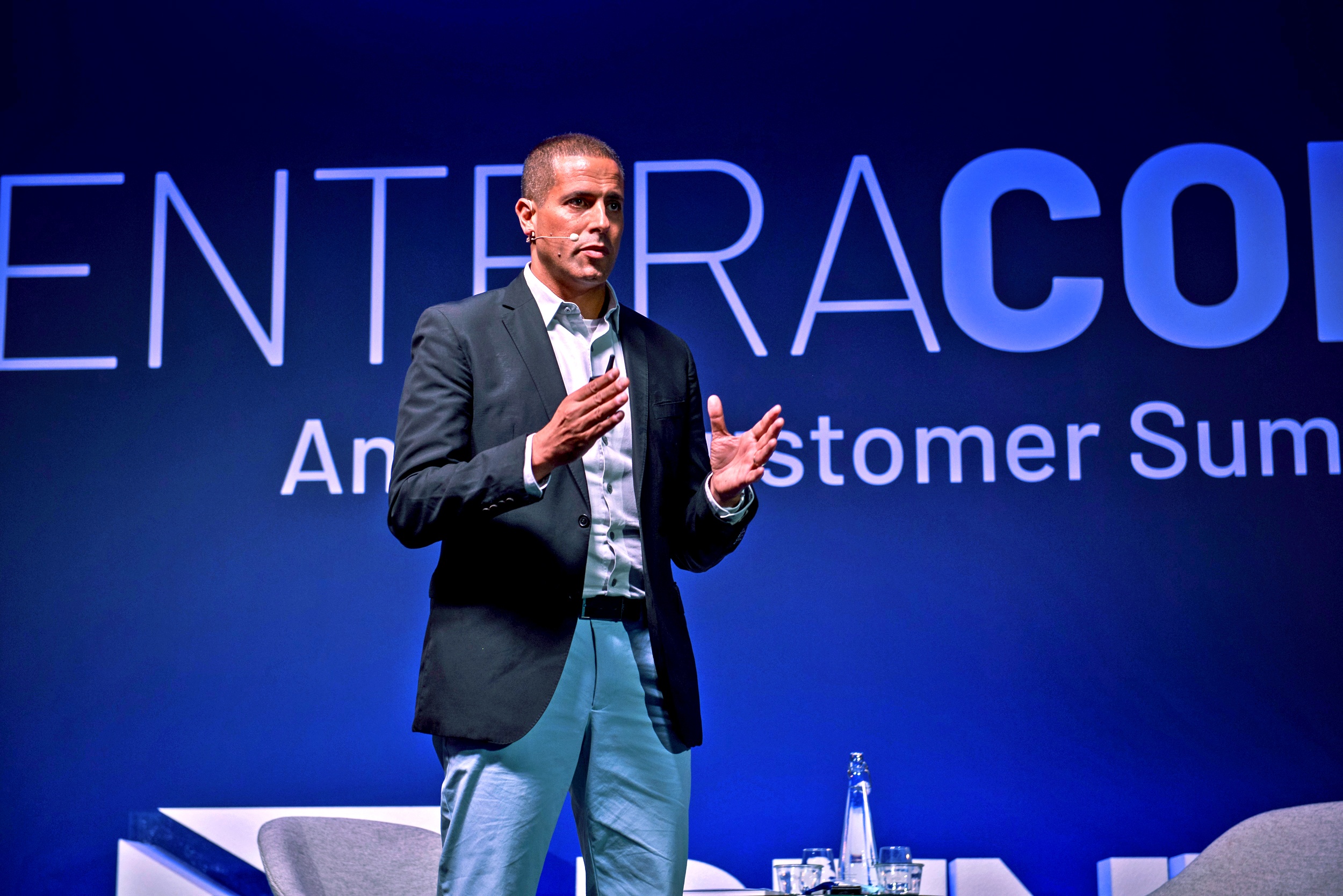 Amitai Ratzon speaking on stage at a Pentera customer summit