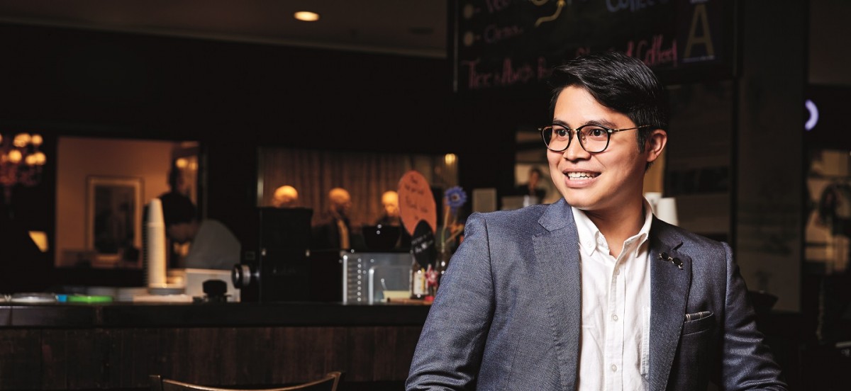 Ammar Roslizar seated in a cafe during a 2018 editorial portrait session