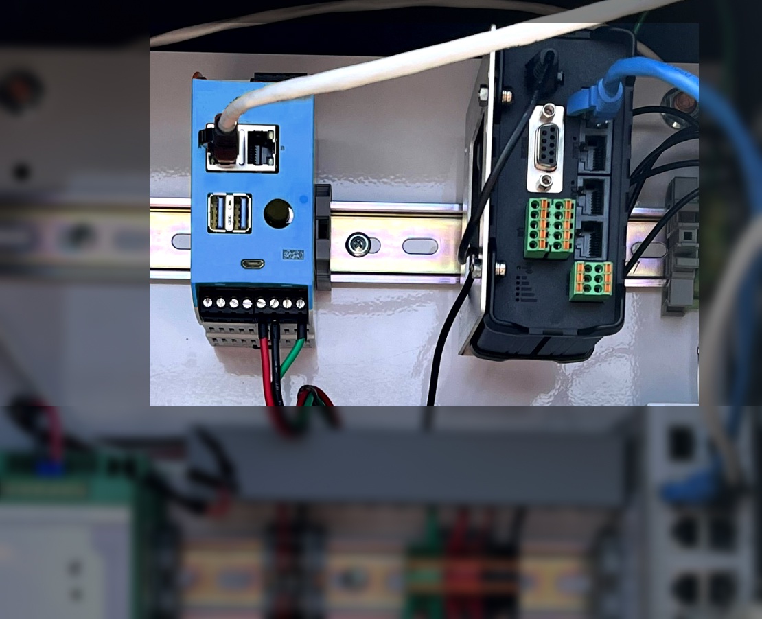 AmpEdge controller and connected industrial equipment inside a cabinet