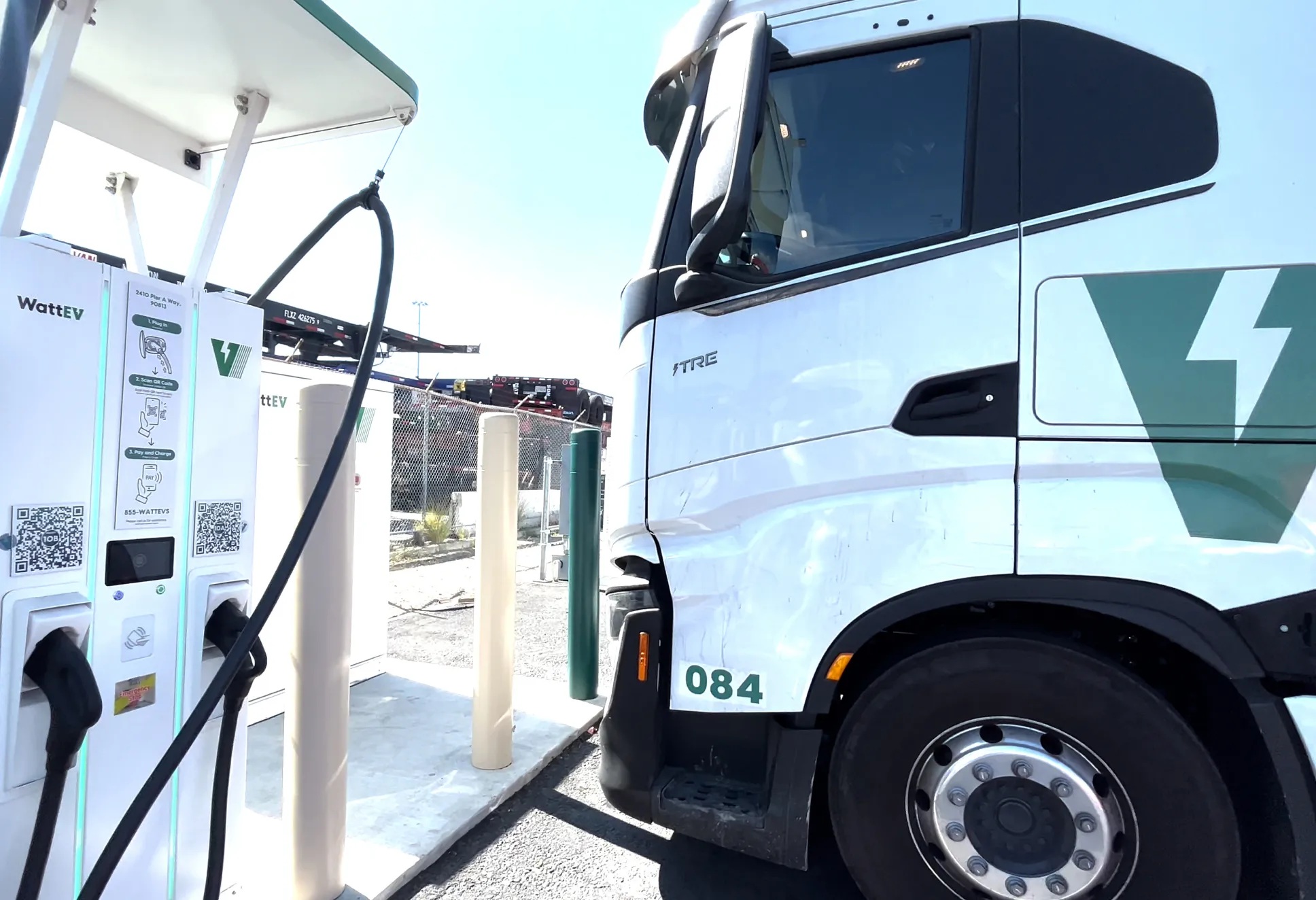 A WattEV electric truck beside charging equipment