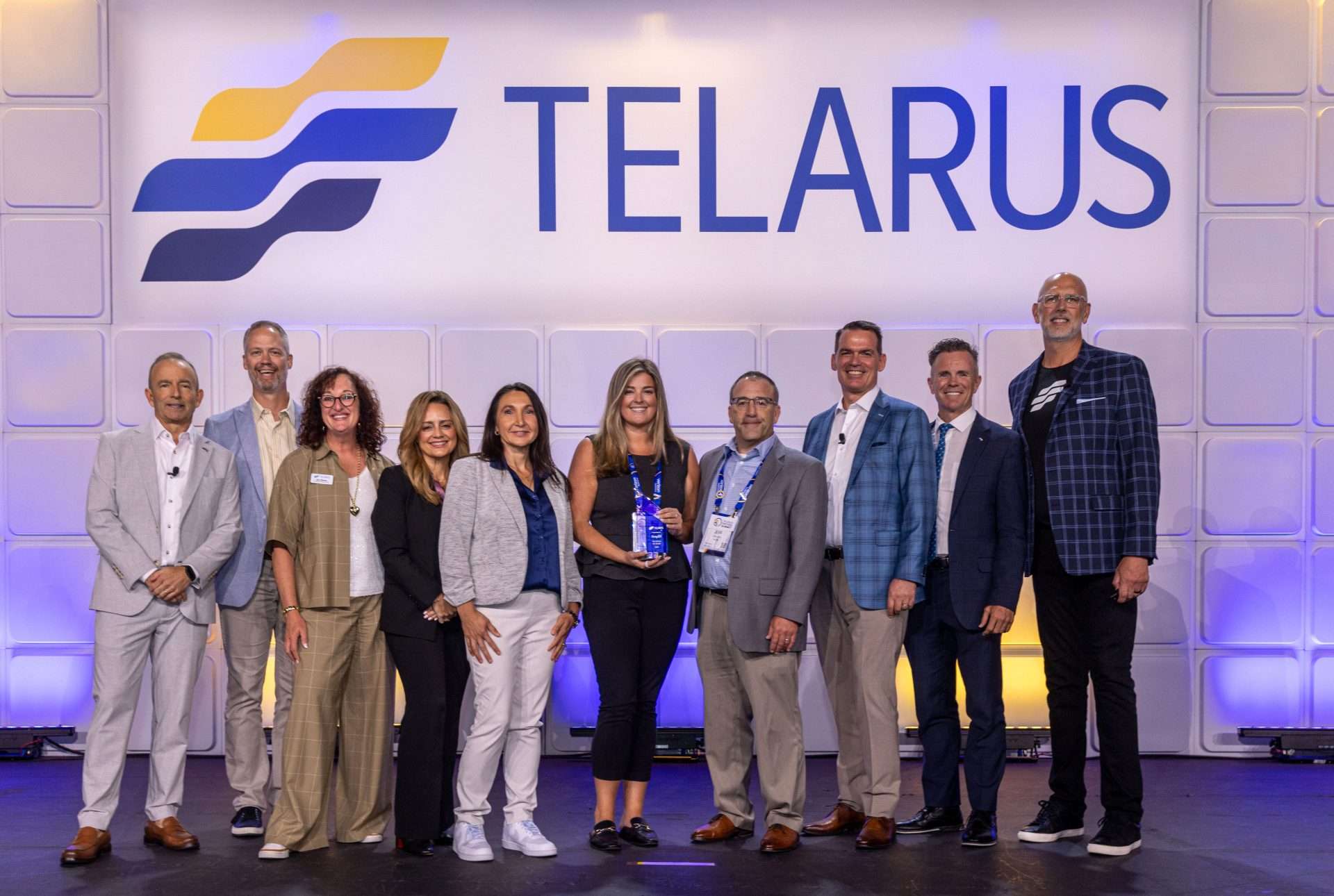 Amplix award-event photograph on the Telarus stage