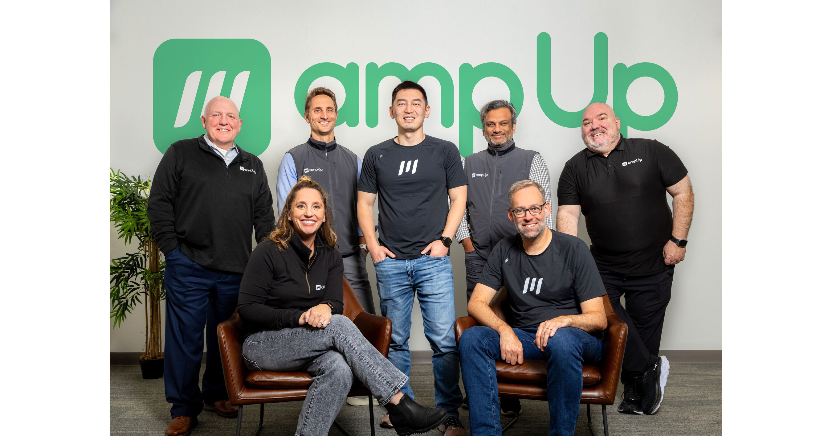 AmpUp executive team gathered at company office