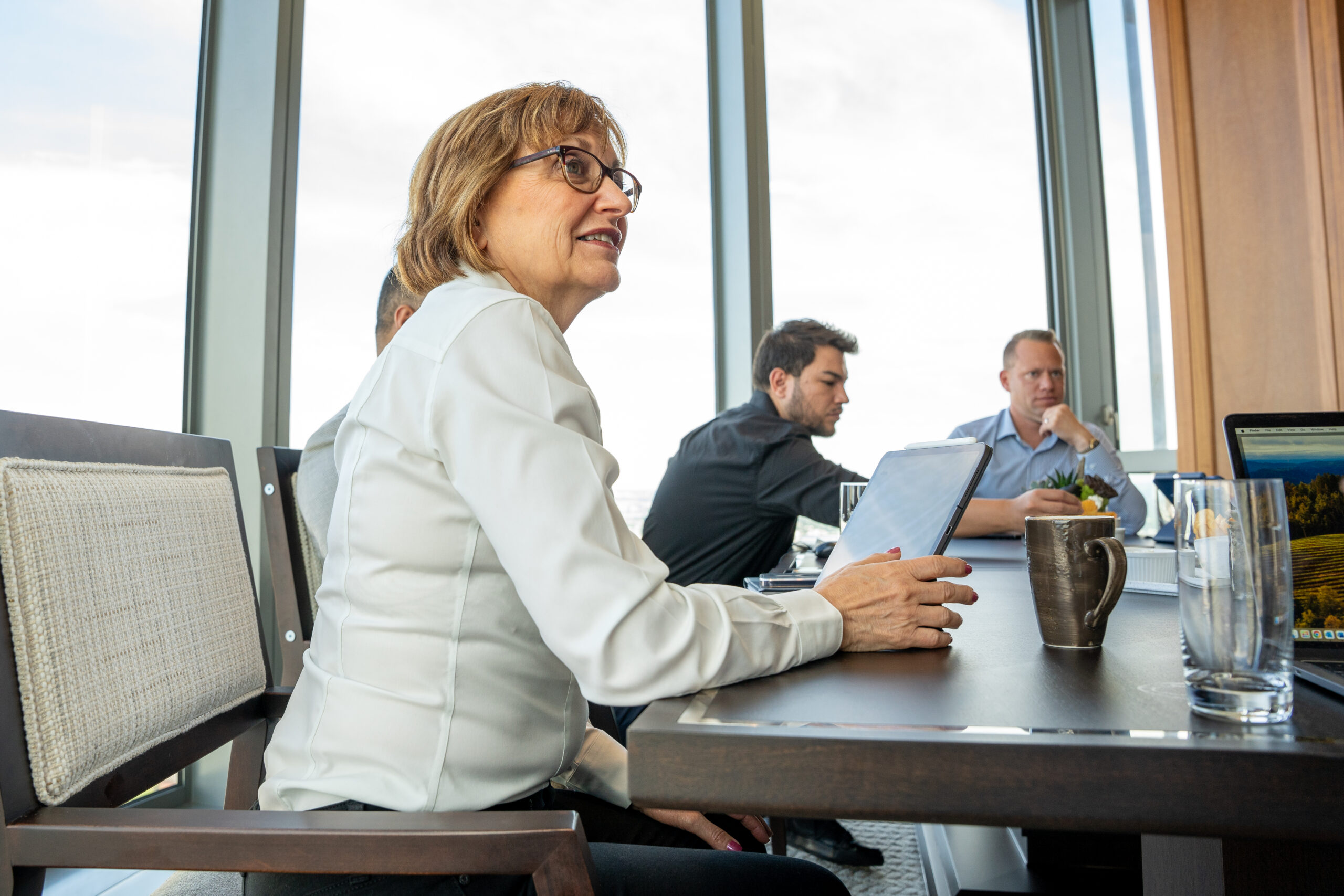 People gathered around a conference table during a working meeting
