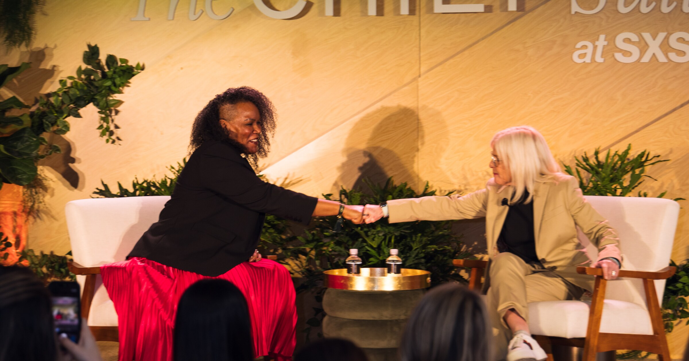 Trey Boynton and Amy Errett greeting each other onstage at the Chief Suite during SXSW 2026