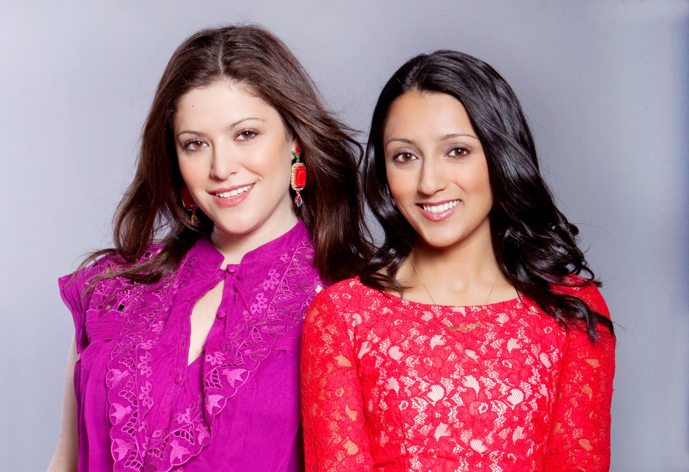 BaubleBar co-founders Daniella Yacobovsky, left, and Amy Jain, right, wearing colorful lace tops