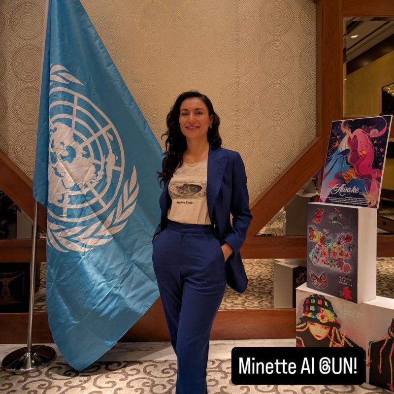 Anaid Chacón standing beside a United Nations flag after presenting Minette AI's mission