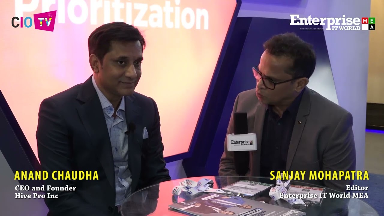 Anand Choudha, left, speaking with interviewer Sanjay Mohapatra at an industry event