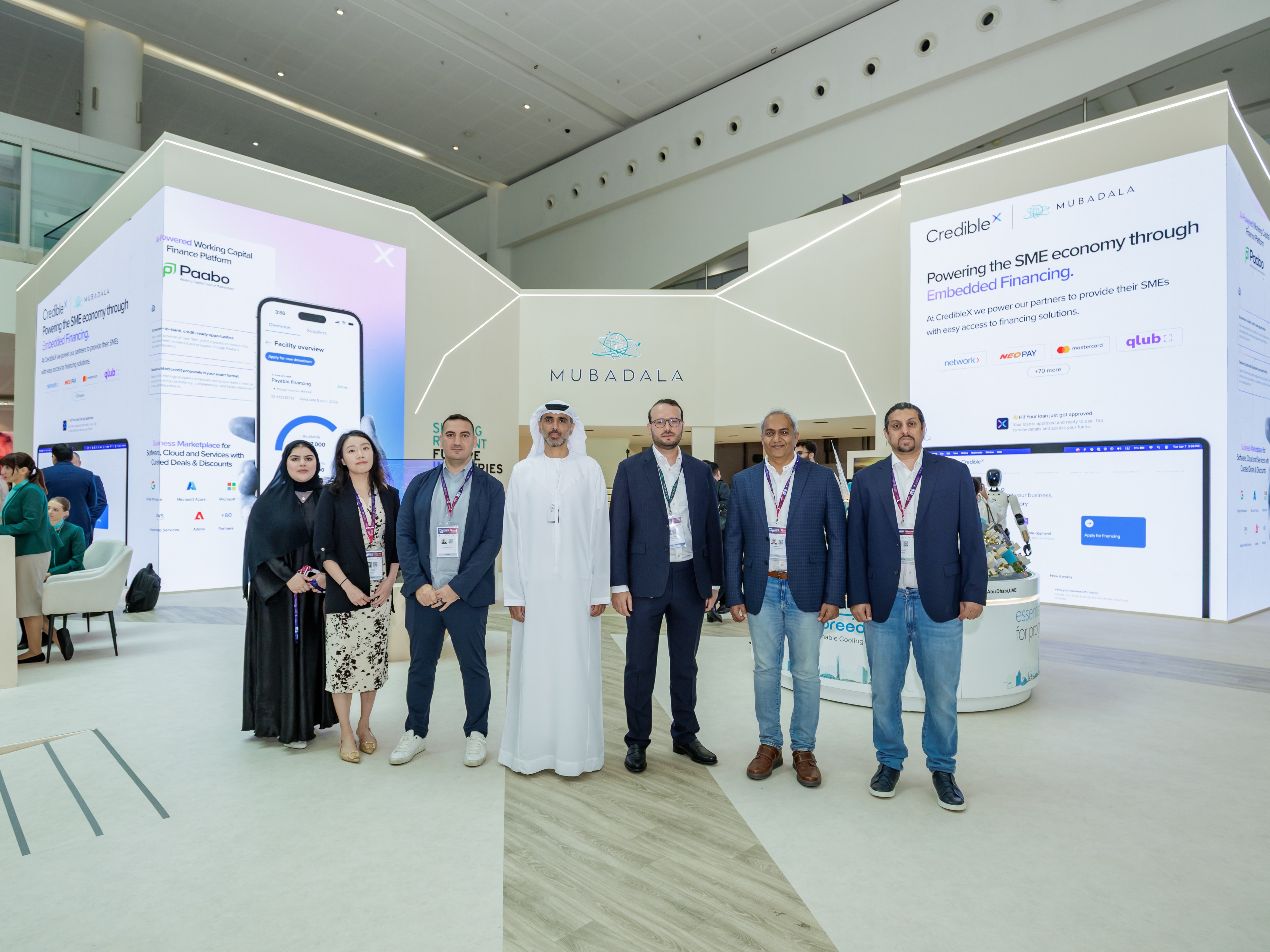 Nagaraj, second from right, with a group beside CredibleX and Mubadala event displays