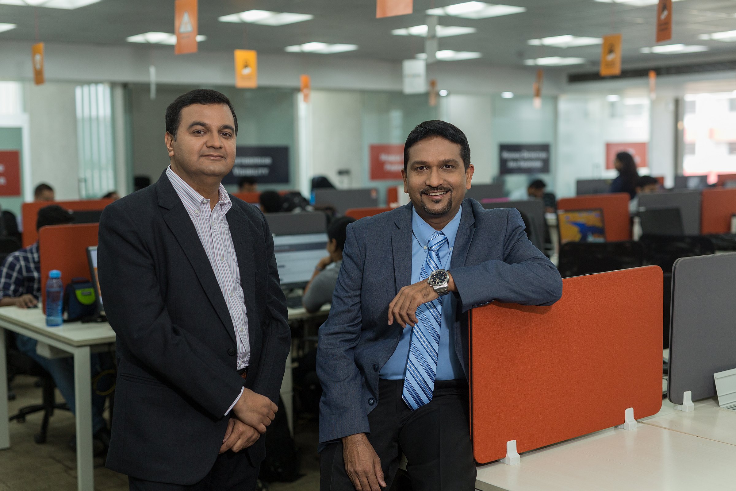 Anand Naik, left, and Pankit Desai standing in a Sequretek office