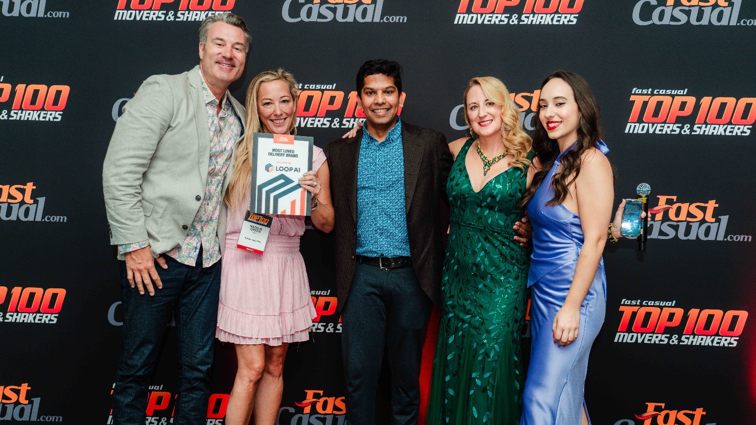 Anand Tumuluru, center, with Nekter representatives and Fast Casual and Loop colleagues at the 2024 Top 100 gala.