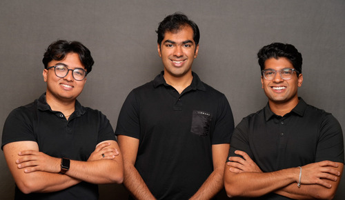 The three original Twine founders standing together against a gray backdrop