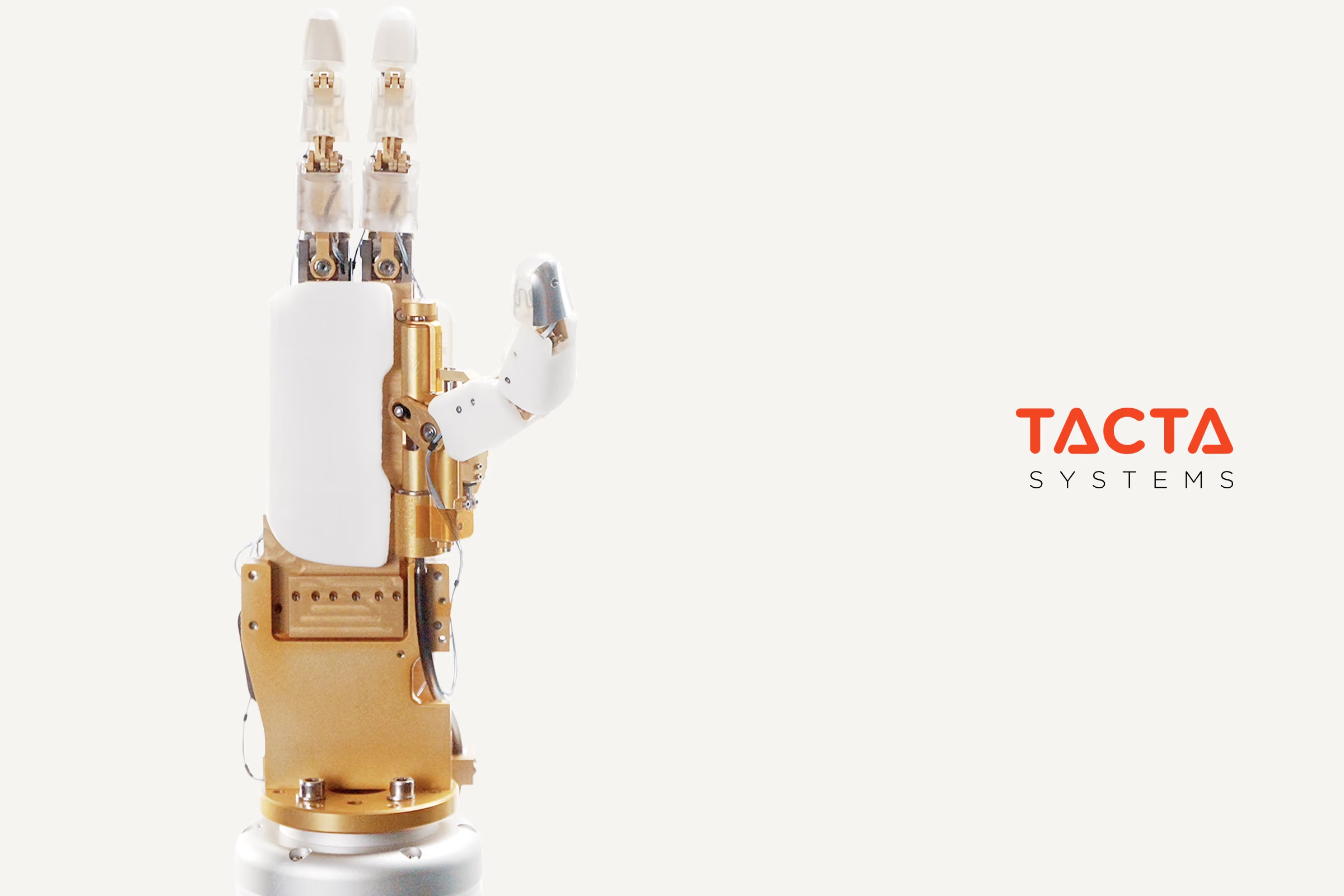 Tacta robotic hand with exposed gold-colored mechanical components and white fingertips