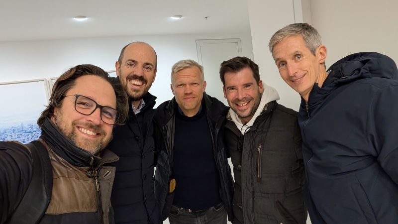 Five IDnow colleagues in jackets after a notary session, with Andreas Bodczek at the far right