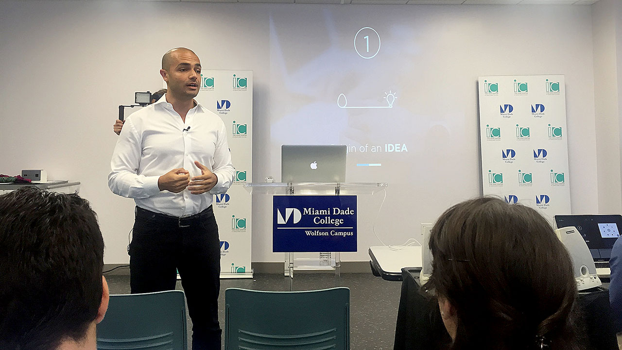 Andrés Moreno speaking to an audience at the Idea Center at Miami Dade College