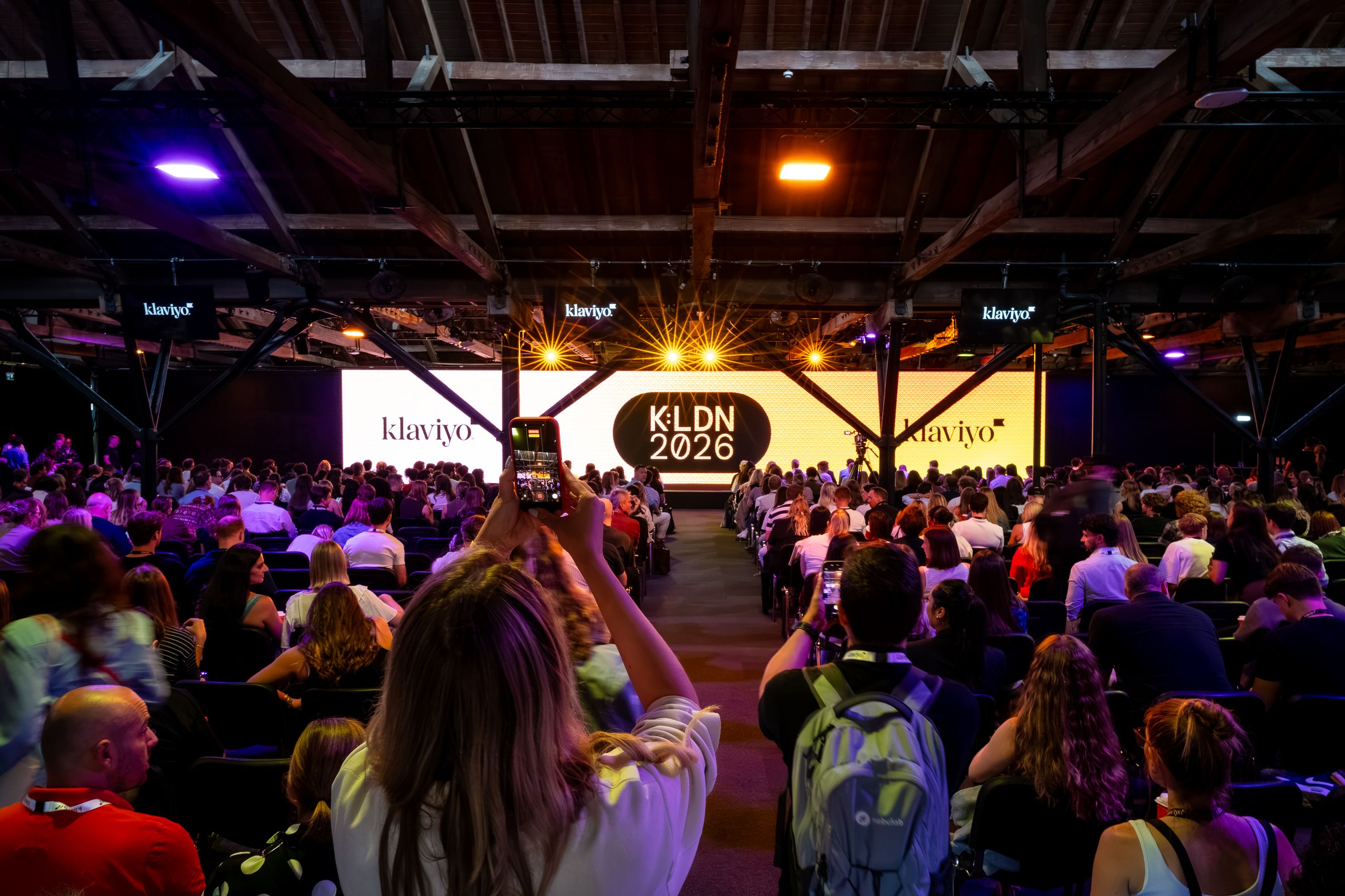 Audience gathered under illuminated Klaviyo screens at K:LDN 2026