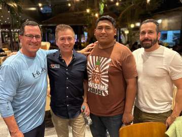 Andrew Carricarte, at right, with fellow Haven of Hope visitors after a staff dinner in Bolivia