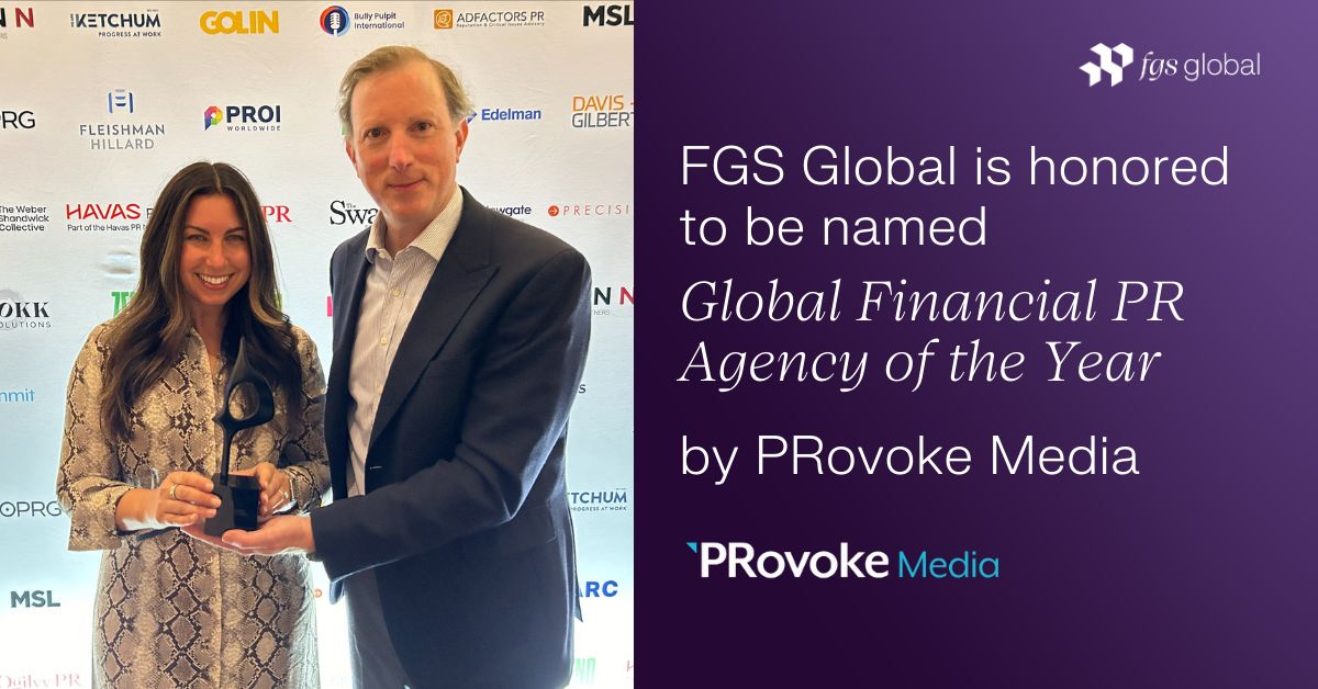 Emily Claffey and Andrew Cole holding FGS Global's Global Financial PR Agency of the Year award at the 2024 PRovoke Global SABRE Awards