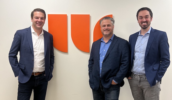 Andrew Cross, Mike Santoro and Dave Parro standing together in the Walker Sands Chicago office