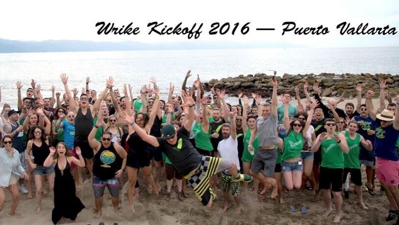 Wrike colleagues gathered on a beach at the 2016 company kickoff in Puerto Vallarta