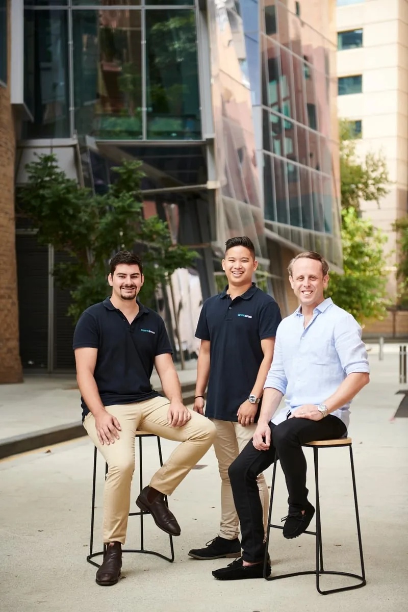 Andrew Grech at left, Richard Voice in the centre and Andrew Porter at right, outside a modern building