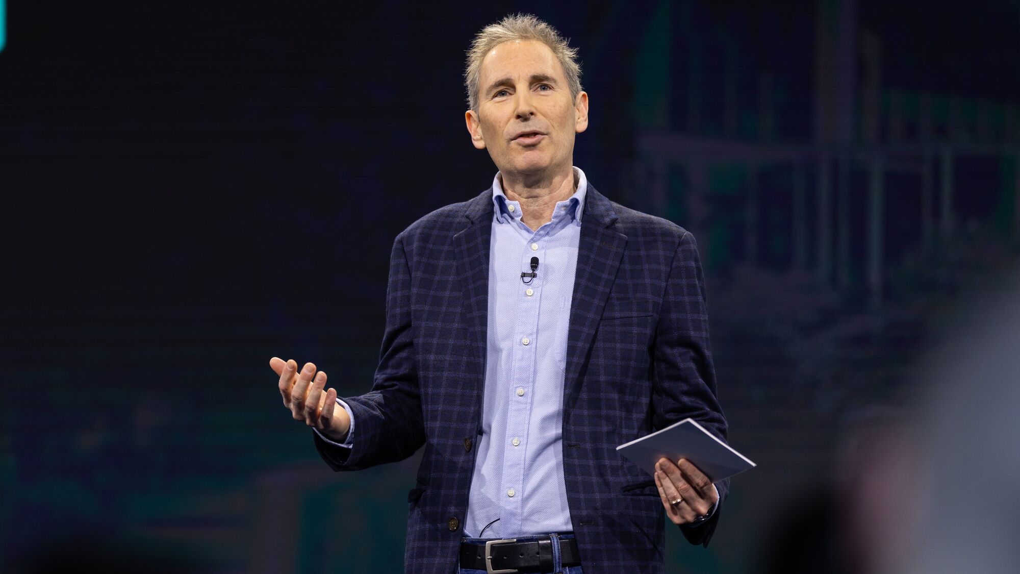 Andy Jassy speaking onstage at an Amazon employee event in Seattle