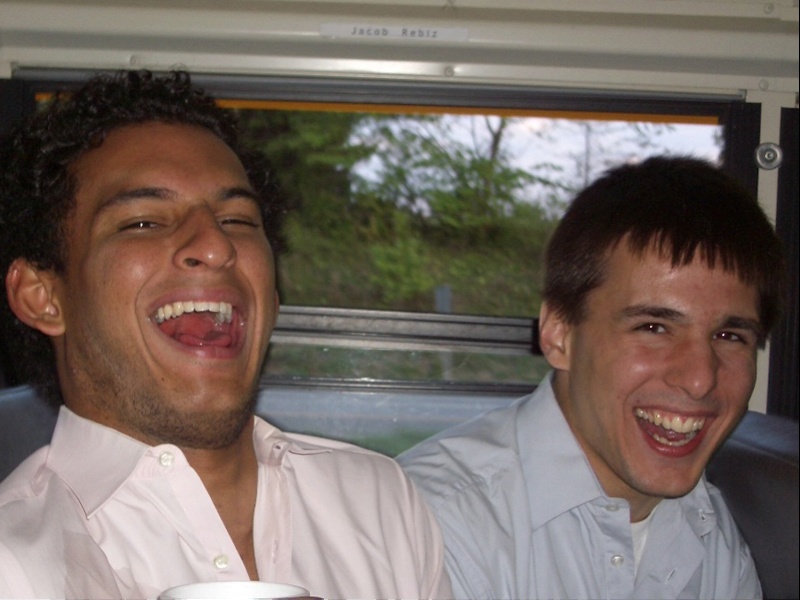 Iqram Magdon-Ismail and Andrew Kortina laughing together in a college-era photograph