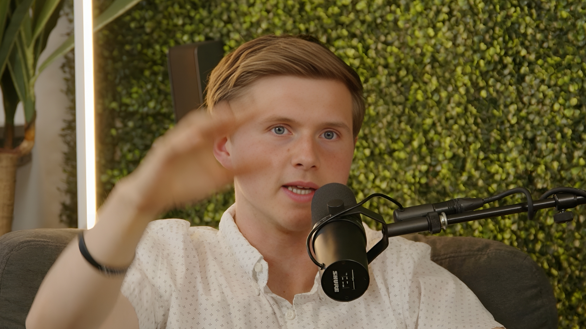 Andrew Rea speaking into a microphone during the Turning Pro podcast