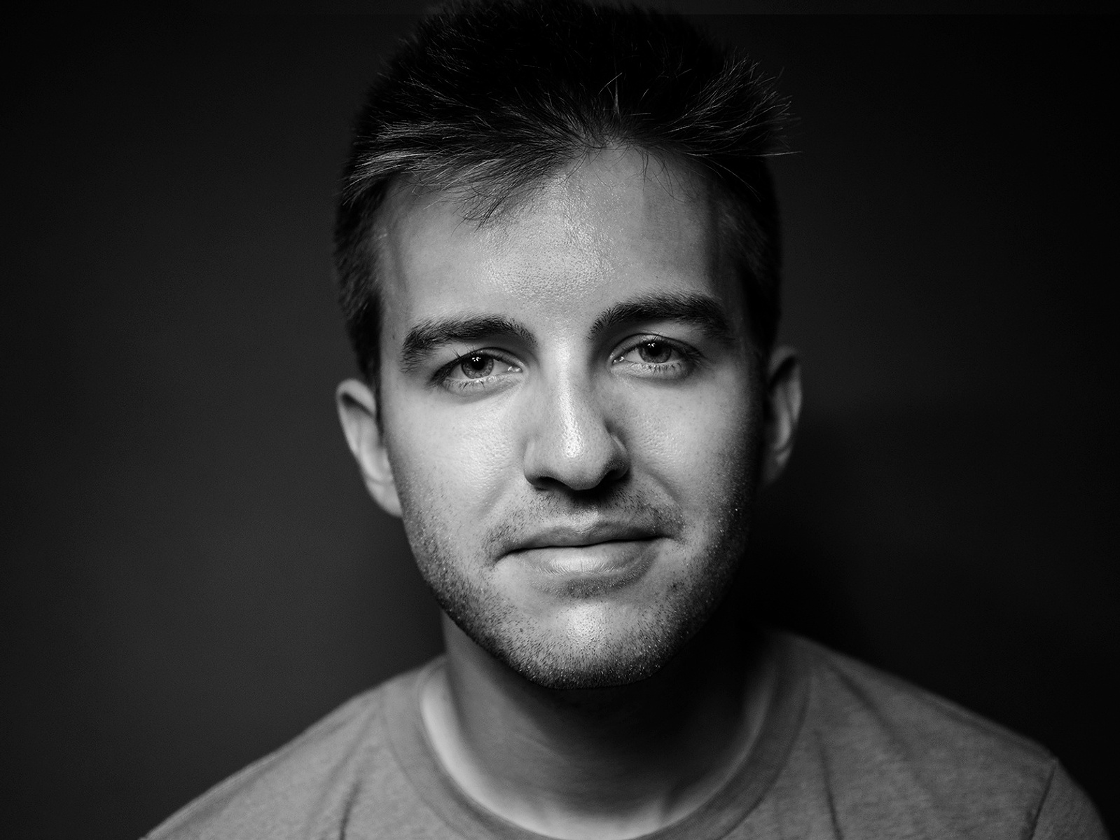 Black-and-white portrait of Andrew Speight looking into the camera