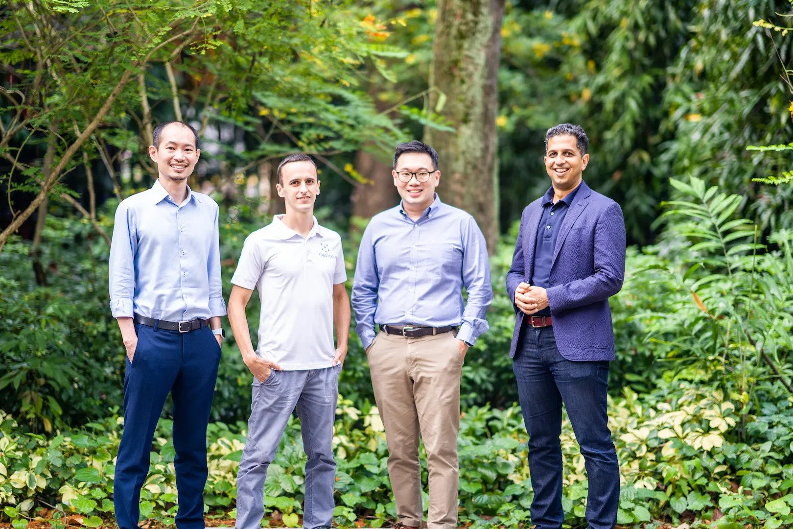 Andrew Wu, Arsen Batagov, Melvin Heng and Aditya Mathur standing together outdoors