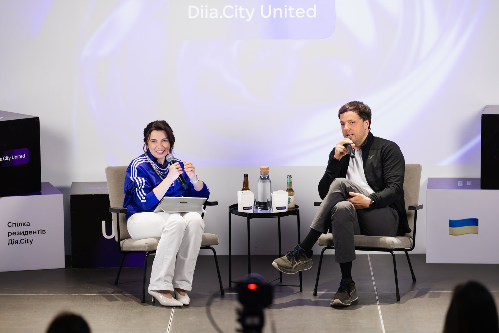 Nataliya Mykolska and Andriy Logvyn in conversation onstage at Diia.City United